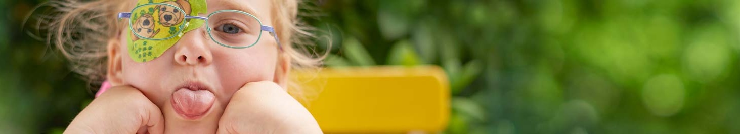 Entête Fille avec cache oculaire ORTOPAD® « Chiens », sort la langue